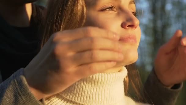 Boyfriend covers girl eyes by hands and she is smiling, happy moments, surprise — Stock Video