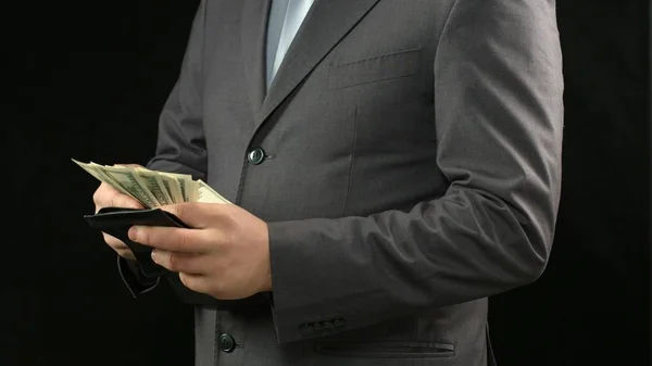 Rich businessman counting dollars in wallet, financial success, personal income — Stock Photo, Image