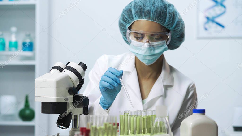 Laboratory worker collecting biological material, biochemical investigation