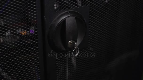 Male opening server doors, administrator checking network-attached storage — Stock Video