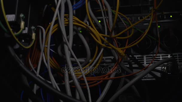 Tangled wires, power cables in datacenter, cleaning up server room cabling mess — Stock Video