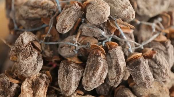 Dried persimmon on sale on Georgia market, healthy tasty dessert, fruit closeup — Stock Video