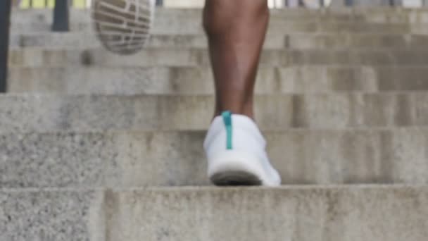 Individual symbolically reaches top of stairs after working hard, accomplishment — Stock Video