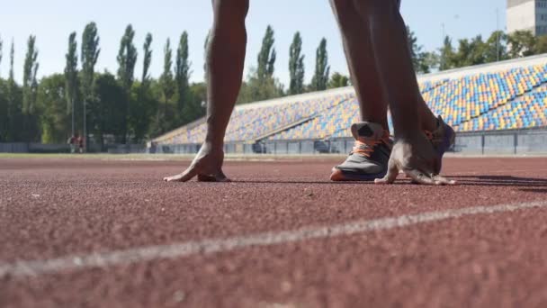 Self-assured strong man running to his goal, training at stadium, new beginnings — Stock Video