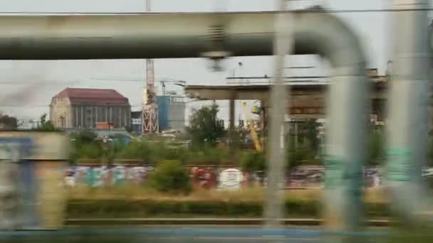 Abandoned industrial area view from moving city train, post-soviet territory — Stock Video