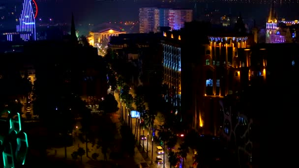 Illuminated buildings and busy streets with cars in Batumi at night, urban life — Stock Video