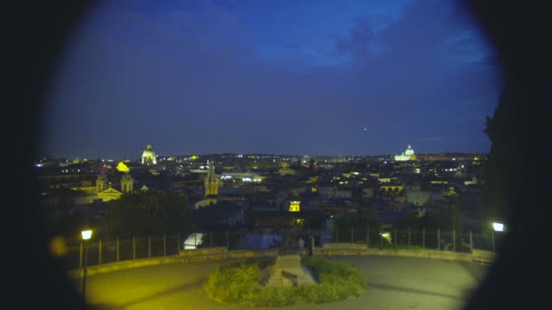 View of beautiful panorama of night Rome through telescope at observation deck — Stock Video