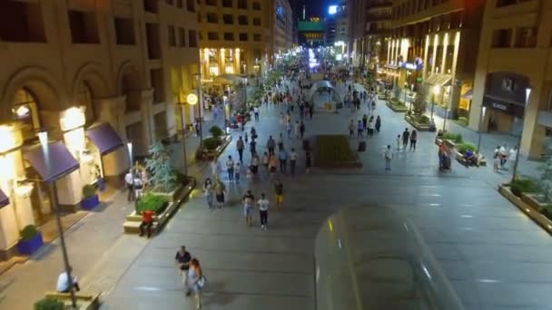 YEREVAN, ARMENIA - CIRCA JUNE 2017: People in the city. Lot of people walking along brightly illuminated shopping street in Yerevan city — Stock Video