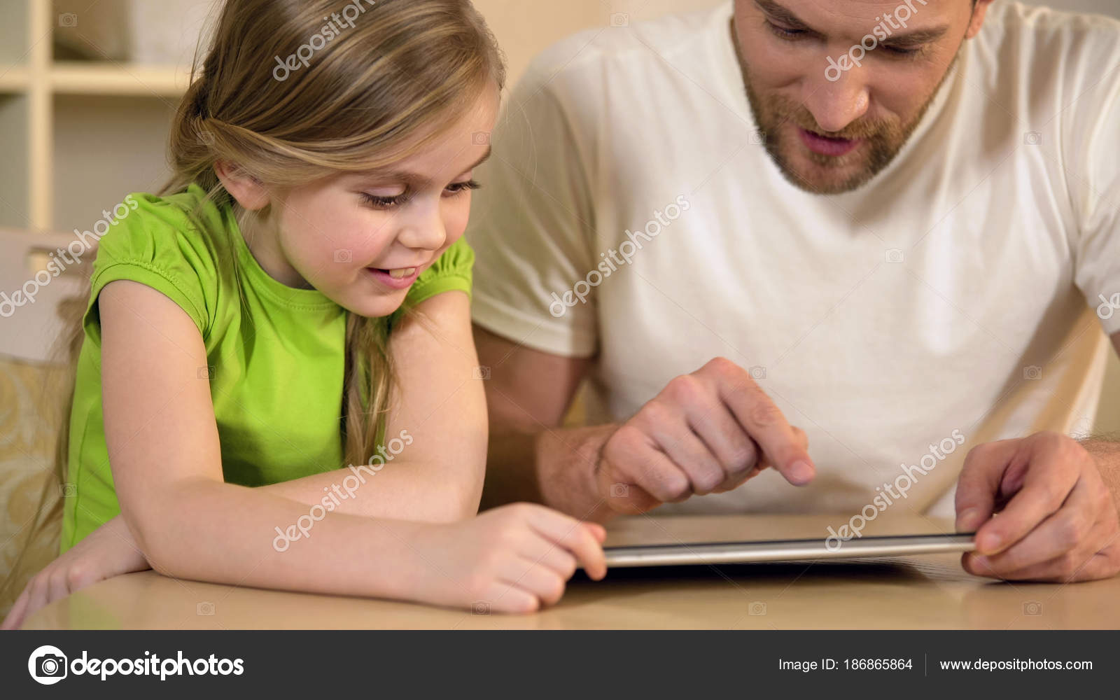 Father showing to daughter funny application on tablet pc, leisure together Stock Photo by ©motortion 186865864 Father showing to daughter funny application on tablet pc, leisure together Stock Photo by ©motortion 186865864
