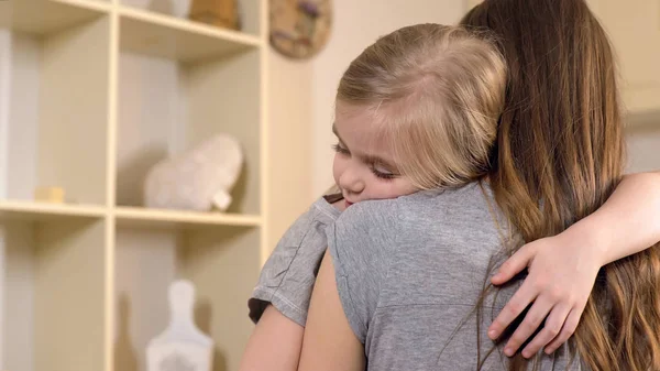 Mother hugging little daughter with love, tender family relationship, support — Stock Photo, Image