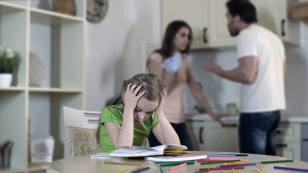 Upset child listening divorcing parents fight, suffering from conflict in family — Stock Photo, Image