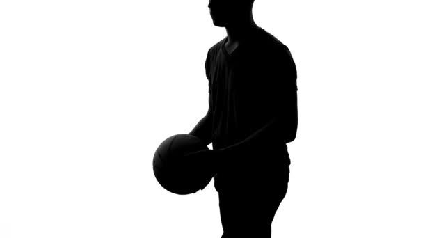 Silhouette of man actively training, doing exercises with ball, healthy life — Stock Video