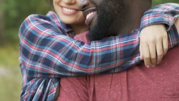 Pretty wife hugging her husband and smiling, newlyweds on honeymoon weekend — Stock Video