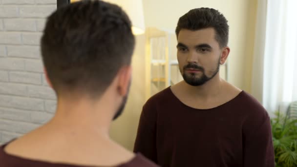 Unconfident man looking in mirror trying on new cloth, appearance insecurities — Stock Video