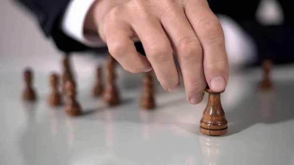 Man making winning queen move in chess game, using successful business strategy — Stock Photo, Image