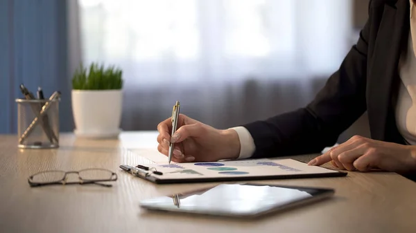 Lady boss looking at statistical graphs, loan review check, financial balance — Stock Photo, Image