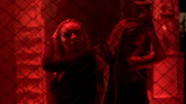 Two Sexy Ladies Standing Metal Chain Fence Red Light Nightlife — Stock Photo, Image