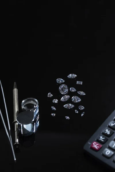 Diamond view. Cut and polished diamond. Luxury diamonds. Diamond tools. Big diamond in tweezers. Diamond trading, diamond sales. Diamond grading and certification. Diamond calculator.