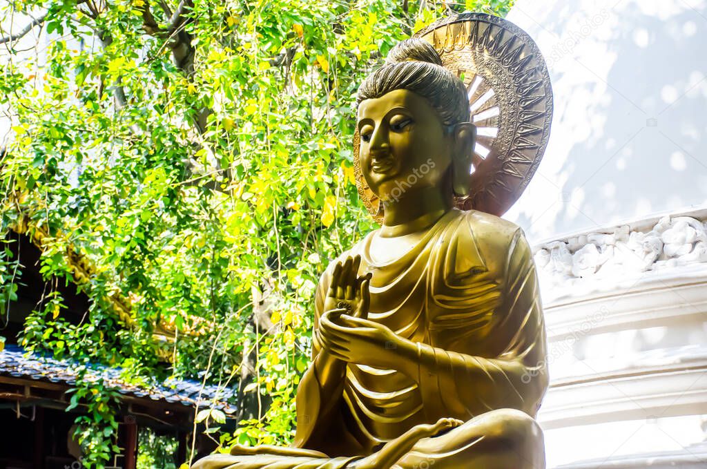 Colombo/Srilanka December 27th 2019: Golden Buddha statue in Gangaramaya Temple in Colombo, Srilanka