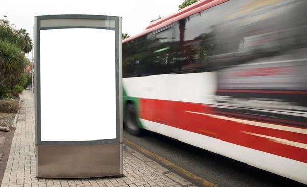 billboard with light in city center with bus line