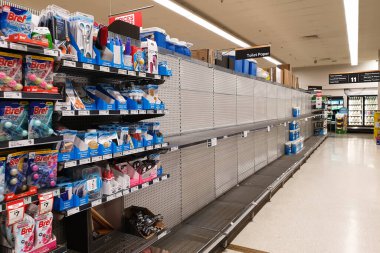 Coles supermarket empty toilet paper shelves amid coronavirus fears and panic buying clipart