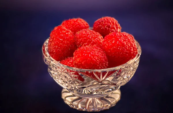 enjoy tasty and healthy raspberries in a vase