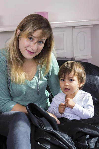 Young woman holding son on arms — Stock Photo, Image