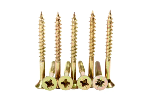 Gold-colored screws — Stock Photo, Image