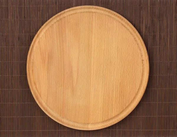 Wooden round empty pizza board — Stock Photo, Image