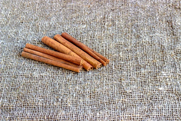 Cinnamon and cloves on a cloth — Stock Photo, Image