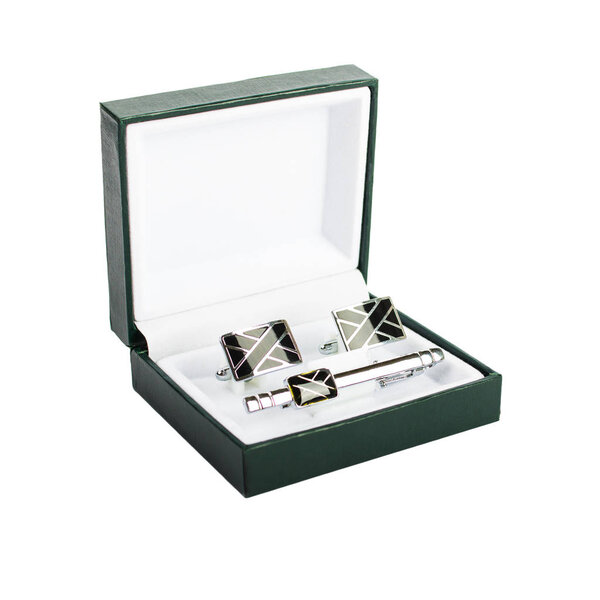 Cuff links in a box on white background