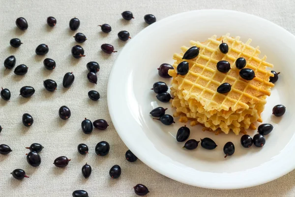 Liege waffles with berries on a napkin — Stock Photo, Image