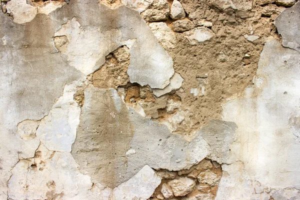 Vieux mur de briques endommagé avec du plâtre. Contexte et textures . — Photo