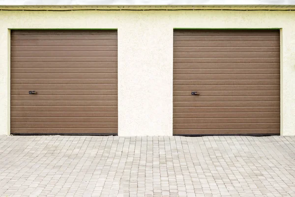 Pair of modern garage doors. Large automatic up and over garage doors for a wealthy holiday home.