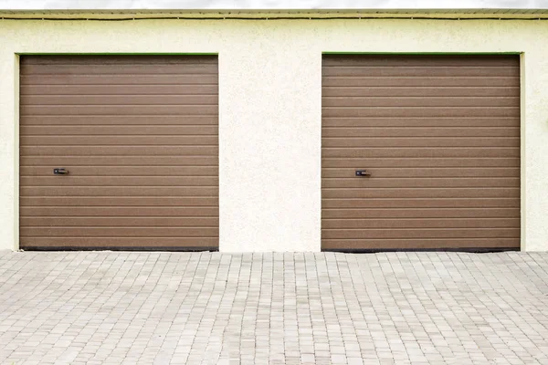 Pair of modern garage doors. Large automatic up and over garage doors ... - Depositphotos 163285378 Stock Photo Pair Of MoDern Garage Doors