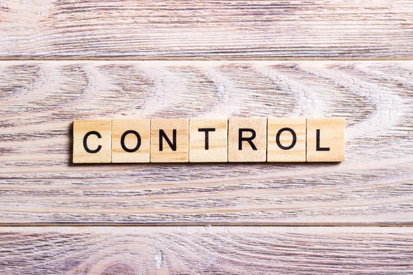 CONTROL word made with building wooden blocks