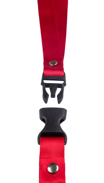 Open black plastic side release buckle with red woven strap attached — Stock Photo, Image
