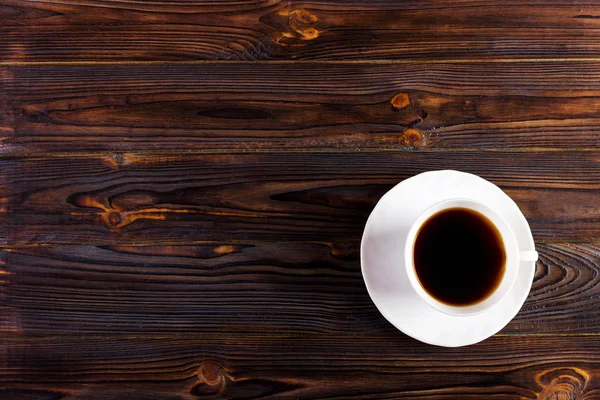 Taza de café sobre textura de madera y fondo con espacio . —  Fotos de Stock