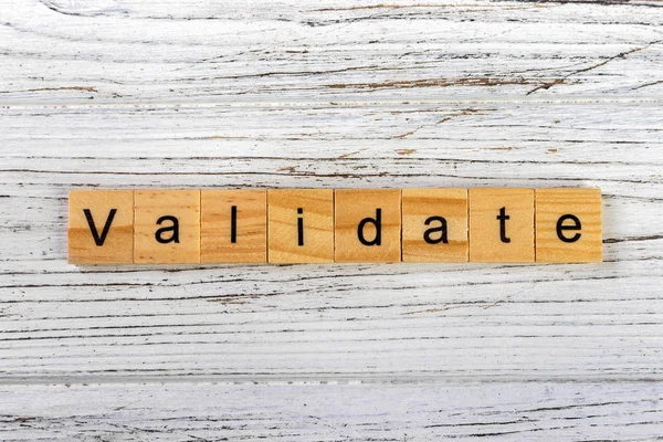 VALIDATE word made with wooden blocks concept — Stock Photo, Image