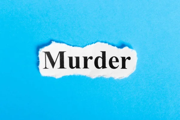 Morderstwo tekstu na papierze. Word morderstwa na kartce papieru. Obrazek koncepcyjny. — Zdjęcie stockowe