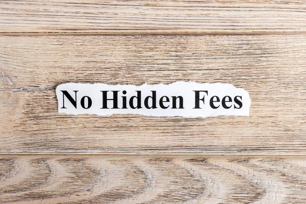 No hidden fees text on paper. Word No hidden fees on torn paper. Concept Image