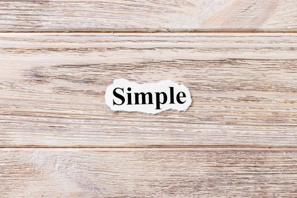 Simple of the word on paper. concept. Words of Simple on a wooden background