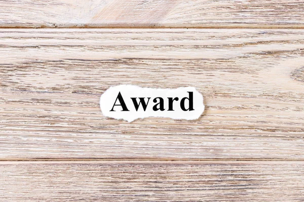 Award of the word on paper. concept. Words of Award on a wooden background — Stock Photo, Image