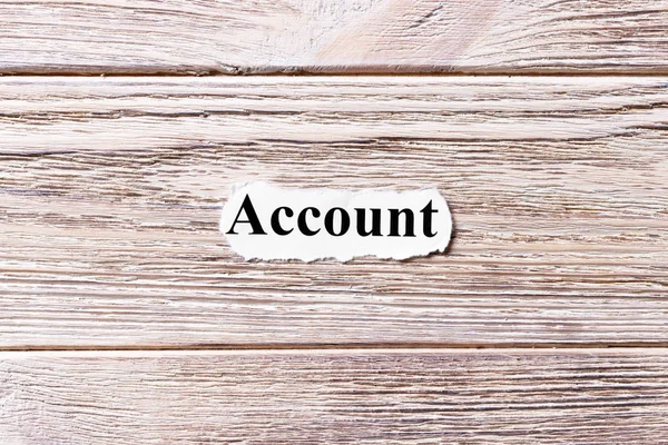 Account of the word on paper. concept. Words of Account on a wooden background