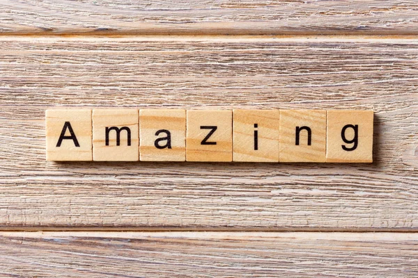 Amazing word written on wood block. amazing text on table, concept — Stock Photo, Image