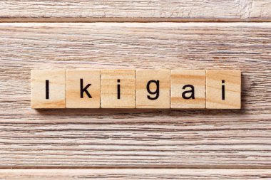 ikigai word written on wood block. ikigai text on table, concept clipart