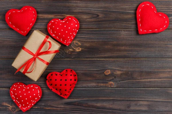 Valentines day vintage background with hearts and a gift box on wooden Table — Stock Photo, Image