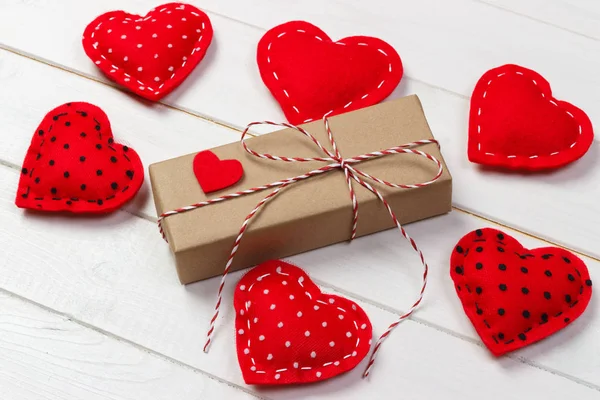 Valentine day background with gift box and hearts — Stock Photo, Image