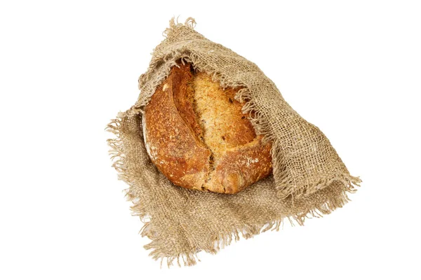 Pan negro apetitoso, sobre tela gruesa de cilicio — Foto de Stock