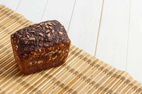 rye bread with seeds on bamboo napkin